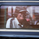 Trump grinning as he drives past supporters in West Palm Beach, Florida, on Feb. 15, 2021.
